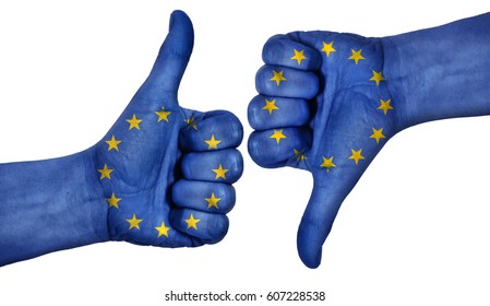 Hand with thumb up and down with the EU flag painted.  Symbol of positivity and crisis in european union.