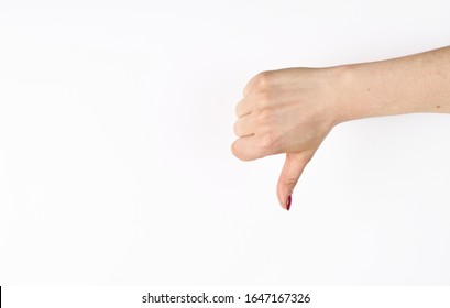 Hand thumb down isolated on the left side on white background. Rejection symbol