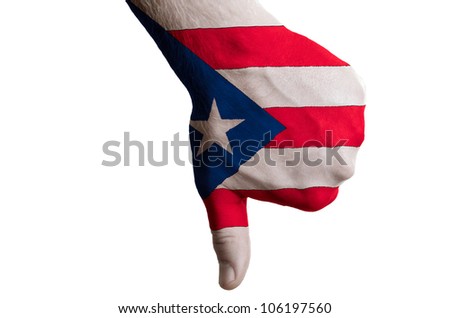 Hand with thumbs down gesture in colored puertorico national flag as symbol of negative political, cultural, social management of country