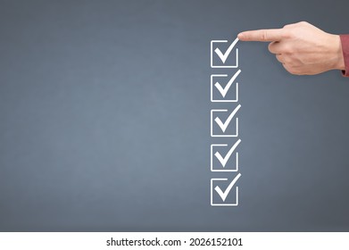 hand ticking checkboxes with marker pen on checklist or to-do list with copy space. gray background. Hands check all the check box. to do list mockup. Check list mockup and man hand - Shutterstock ID 2026152101