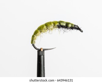 hand tied fishing fly, fly for fishing on a white background, hand made