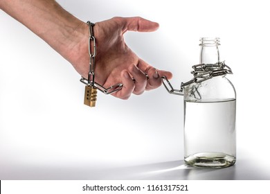 Hand Tied Metal Chain With Bottle On White Background. Alcohol Dependence