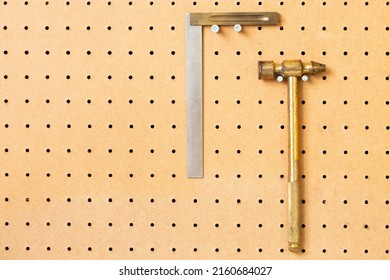 Hand Tools On A Workshop Peg Board.