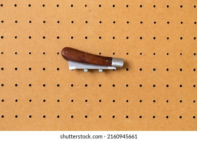 Hand Tools On A Workshop Peg Board.