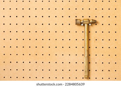 hand tools on a workshop peg board. - Powered by Shutterstock