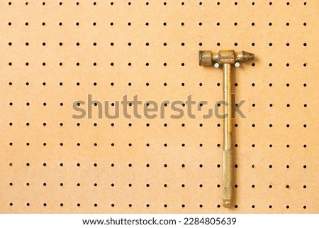 hand tools on a workshop peg board.