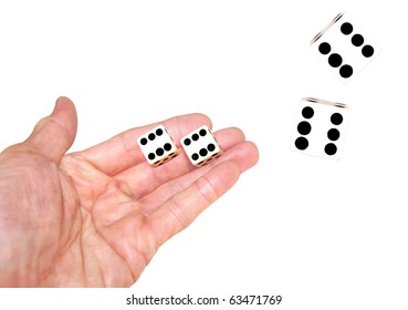 Hand Tossing Pair Of Dice , White Background