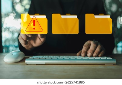 Hand touch a folder with a cybersecurity warning. Warning symbol for malware, virus, or spyware. Computer network threats. Cybersecurity alert with digital file folder.