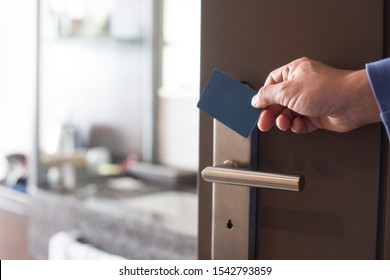 Hand Touch Keycard On Hotel Door