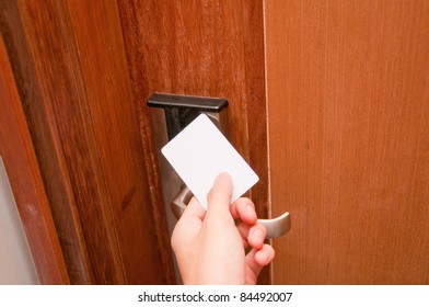 Hand Touch Keycard On Hotel Door