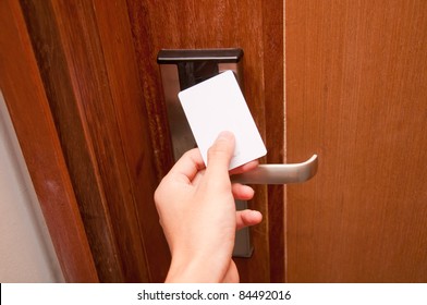 Hand Touch Keycard On Hotel Door