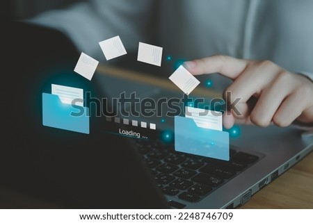 Hand touch on document for Send of document on internet. Data transfer, Transfer file of data between folder, Backup data, Exchange of file on folder,  DMS. Virtual document loading to another folder.