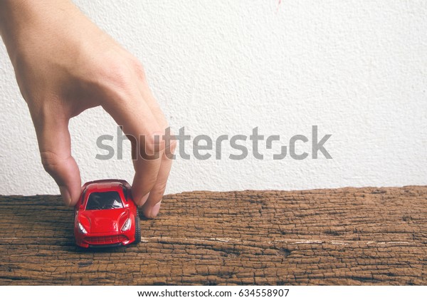 hand touch red car\
in car for cash concept
