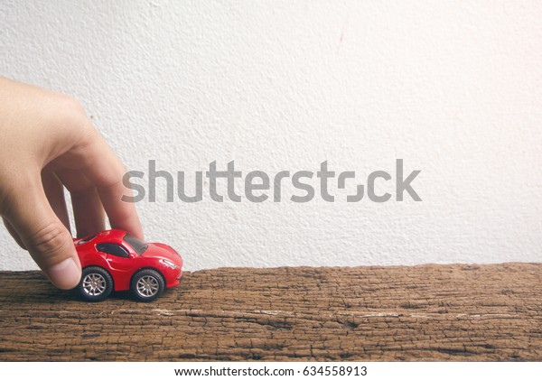 hand touch red car\
in car for cash concept