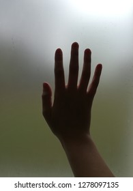 Hand touching blank window
