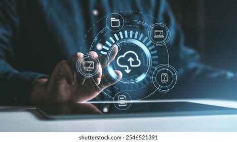Hand touching a digital cloud interface with icons for files, computers, smartphones on a dark background. Concept of cloud data storage service - Powered by Shutterstock - Get 15% off with code: PIKWIZARD15