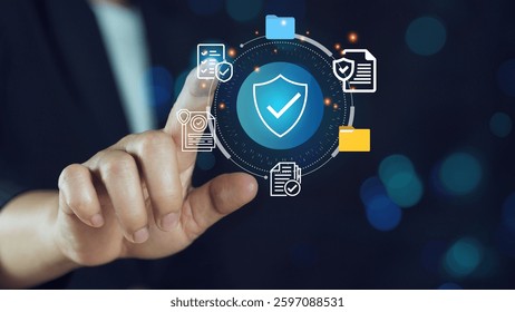 Hand touching a digital padlock icon on a virtual screen a cyber security and data protection.Cybersecurity concept with digital shield and data protection icons.