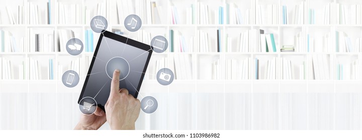 Hand Touching Digital Tablet With Icons Isolated On Library Background