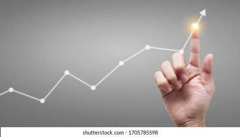 Hand touching a graphs of financial indicator and accounting market economy analysis chart