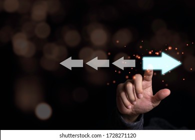 Hand Touching Light Blue Arrow Which Opposite Direction With White Arrow. Disruption And Different Thinking For Discovery New Technology  And New Business Opportunity Concept.