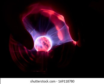 Hand Touching Plasma Ball