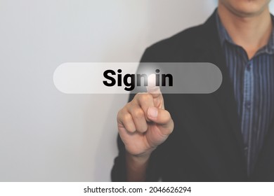 hand touching sign in button on virtual screen