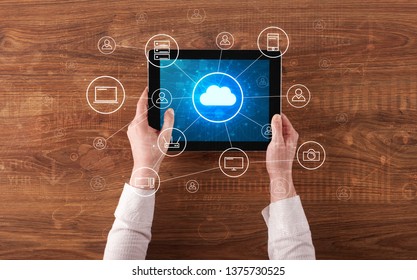 Hand touching tablet with cloud computing and online storage concept - Shutterstock ID 1375730525