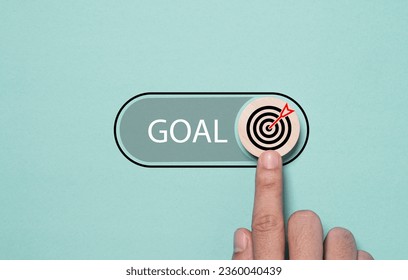 Hand touching to toggle with button with dartboard and arrow to open status for start business objective target and goal concept.