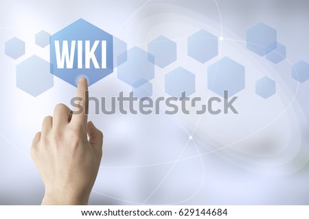 hand touching a touch screen interface with wiki
