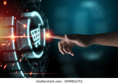 Hand touching to virtual info graphics with trolley cart icons , Technology online shopping business concept. - Shutterstock ID 1949816752