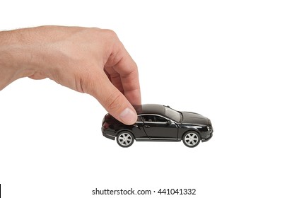 Hand With Toy Car Isolated On White Background