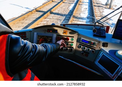 Hand Of Tram Driver On The Dashboard.
