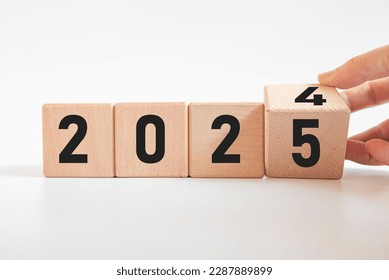 Hand translated wooden cube from 2024 to 2024.new business goal strategy concept.2024 goal planning business concept.