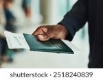 Hand, travel and person with passport at airport for journey, immigration or holiday. Closeup, boarding pass or passenger with documents or airplane ticket for flight transportation, trip or vacation