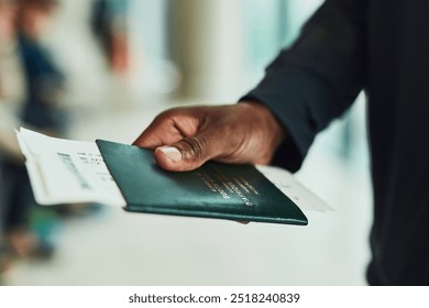 Hand, travel and person with passport at airport for journey, immigration or holiday. Closeup, boarding pass or passenger with documents or airplane ticket for flight transportation, trip or vacation - Powered by Shutterstock