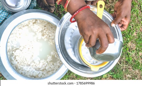 Hand Of A Tribal Woman Pouring Handia [rice Beer] For Sale. Shot At Kaptipada, Odisha, India On July, 2020....