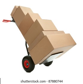Hand truck with cardboard boxes on it ready for delivery over white background