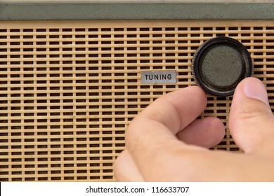 Hand With Tuner Radio Knob