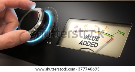 Hand turning a knob up to the maximum with a dial where it is written the text value added. Concept image for illustration of competitive advantage.