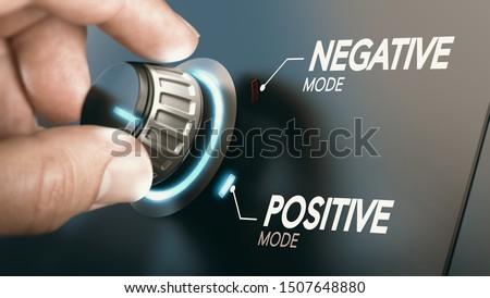 Hand turning a knob to switch from negative to positive mindset. Psychology concept. Composite image between a photography and a 3D background.