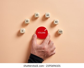 Hand turning volume control knob for maximum loudness. - Shutterstock ID 2195696101