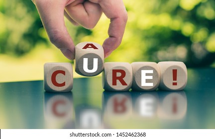Hand turns a cube and changes the word "care" to "cure".