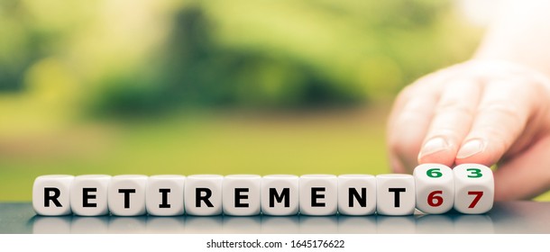 Hand turns dice and changes the expression "retirement 67" to "retirement 63". - Shutterstock ID 1645176622