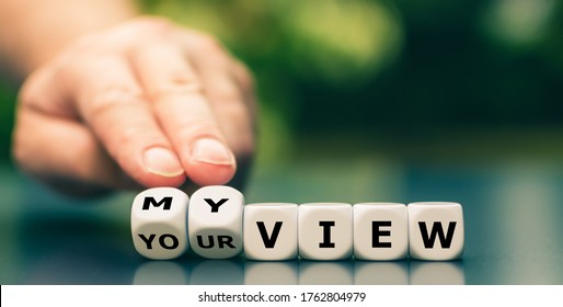 Hand turns dice and changes the expression "your view" to "my view". - Shutterstock ID 1762804979