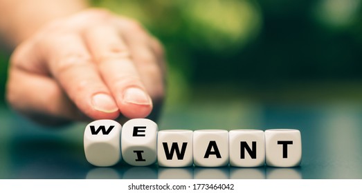 Hand turns dice and changes the expression "I want" to "we want". - Shutterstock ID 1773464042