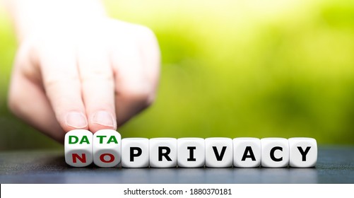 Hand turns dice and changes the expression "no privacy" to "data privacy". - Shutterstock ID 1880370181