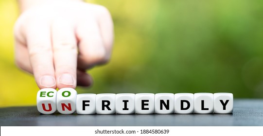 Hand turns dice and changes the expression "unfriendly" to "eco friendly". - Shutterstock ID 1884580639