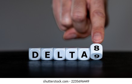 Hand turns dice and changes the expression 'delta 9' to 'delta 8'. Symbol for the Delta-8-tetrahydrocannabinol, a psychoactive cannabinoid found in the Cannabis plant.