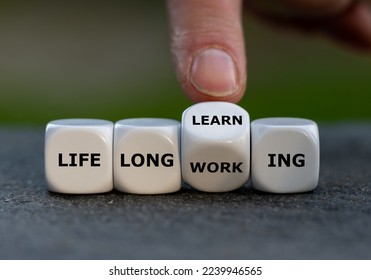 Hand turns dice and changes the expression 'life long working' to ' life long learning'.