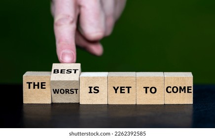 Hand turns dice and changes the expression 'the worst is yet to come' to 'the best is yet to come'.